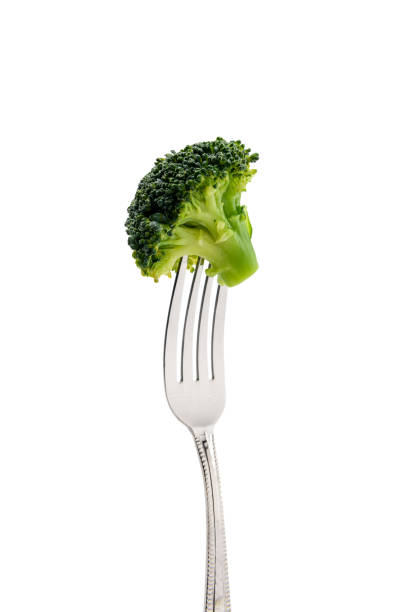 istock fresh broccoli on fork isolated on white. healthy lifestyle concept 682527204