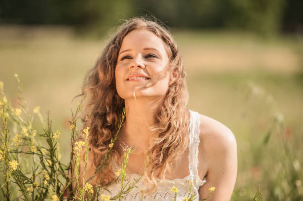 istock Beautiful Young Woman in a Spring Field 682532470