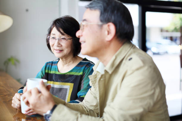 istock An old couple talking happily in a cafe 682535080