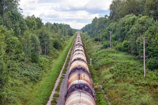 Set of train tanks with oil and fuel transport by rail - countryside view stock photo