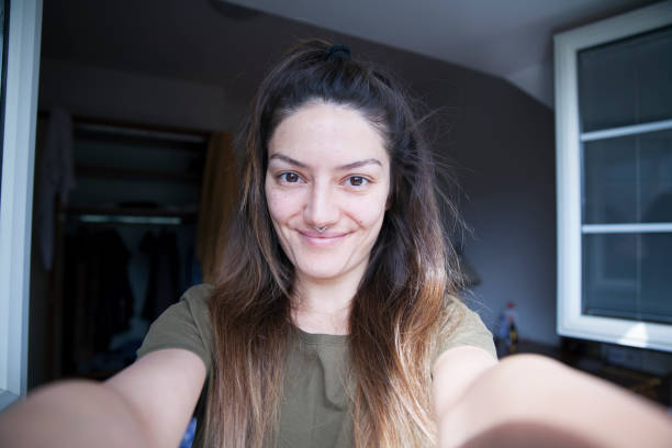 istock Beautiful woman taking morning selfie 682540344
