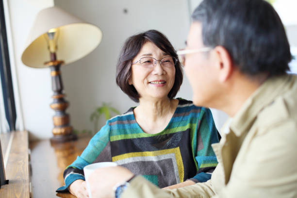 istock An old couple talking happily in a cafe 682554952