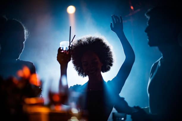 istock People dancing in the club 682559532