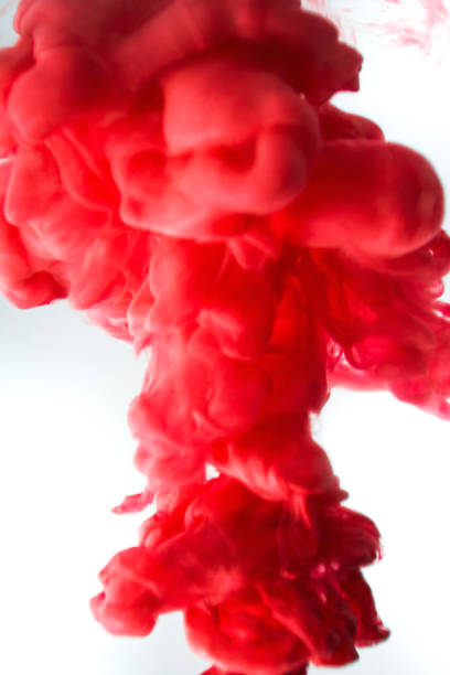 istock red ink in water isolated on white background 682564102