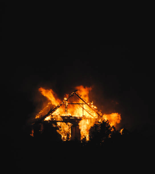 istock Abandoned Detroit house on fire during the night 682564104