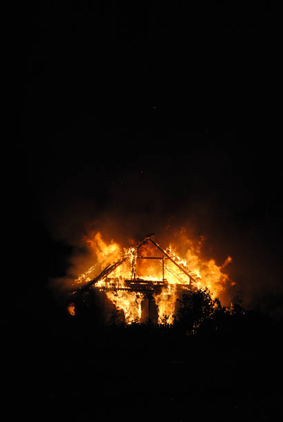 istock A Wooden house in flames 682564108