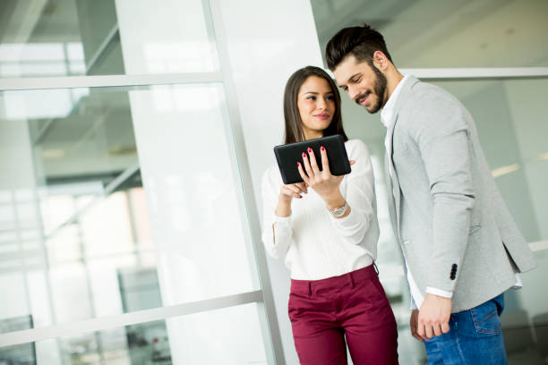 istock Business couple using tablet in the office 682568526