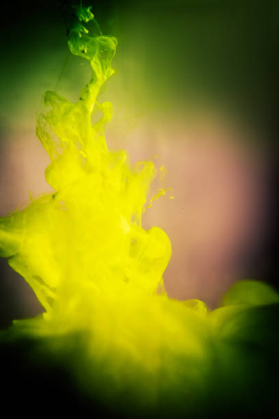 istock yellow ink in water isolated on white background 682568550