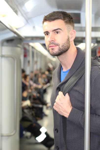 istock Commuter standing in urban metro 682571822
