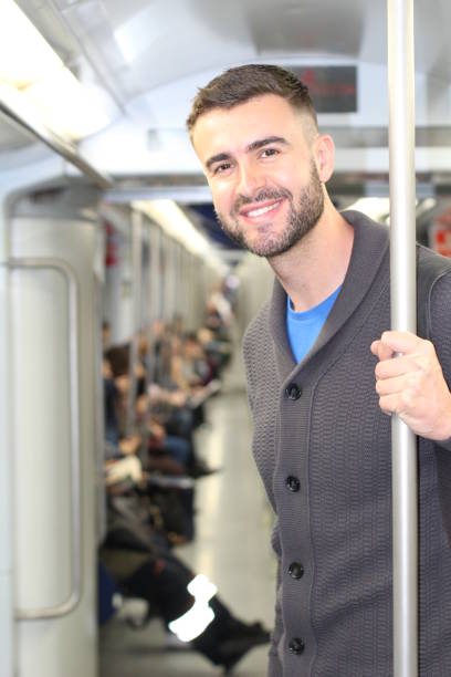 istock Commuter standing in urban metro 682571976