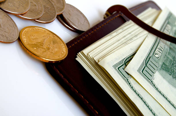 istock Wallet with hundred-dollar bills and coins. 682572062