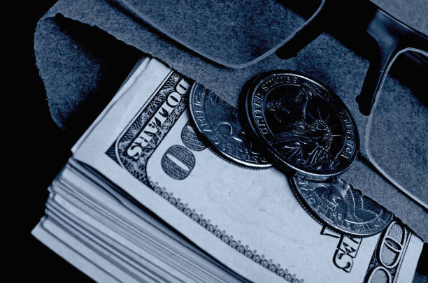 istock Still life with cash dollars in black and white. 682574502