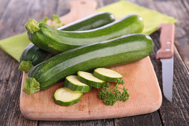 raw zucchini raw zucchini Courgette stock pictures, royalty-free photos & images