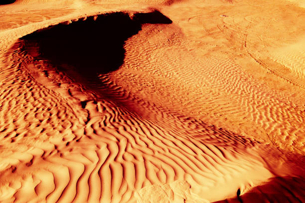 istock Red-yellow bloody desert texture and background. Natural patterns on the sand 682575632