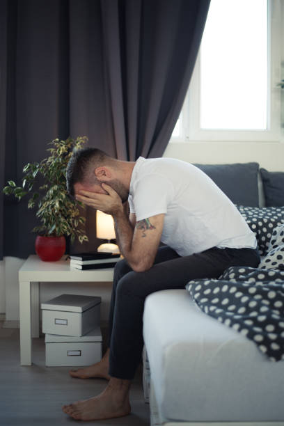 istock Young cell phone addict man in bed using smartphone 682581764