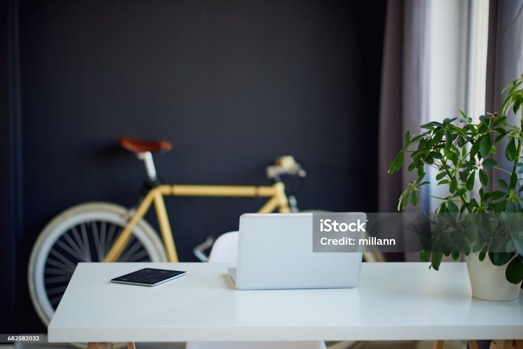 Loft Designed Working Space Loft Designed Working Space with bicycle Working At Home Stock Photo