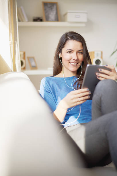 istock Caucasian woman sitting on sofa 682585898