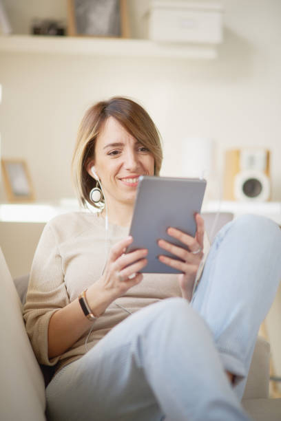 istock Caucasian woman sitting on sofa 682585980