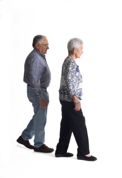 istock Full portrait couple walking on a white background 682589318