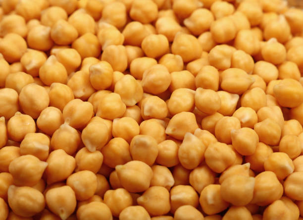 istock Cooked soaked chickpea beans close up background 682592644