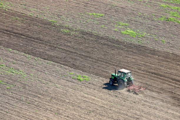 istock tractor plowing a field agriculture 682592920