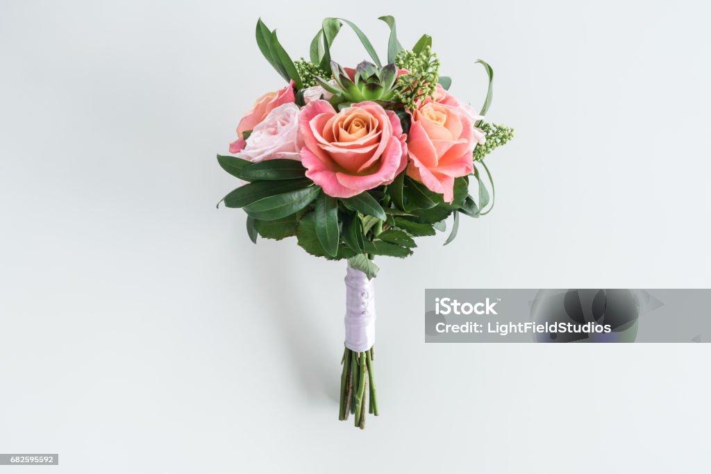 Close-up view of beautiful bouquet of roses and succulents isolated on white Bouquet Stock Photo