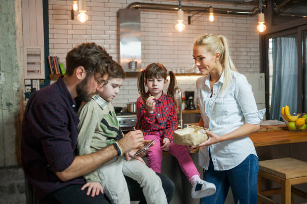 istock Family in the kitchen spending time together 682596364