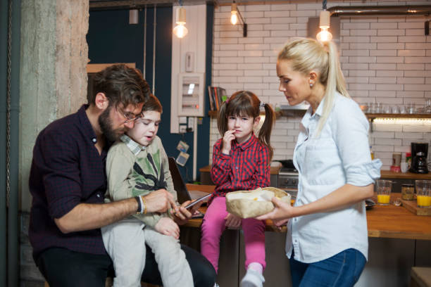 istock Family in the kitchen spending time together 682596446
