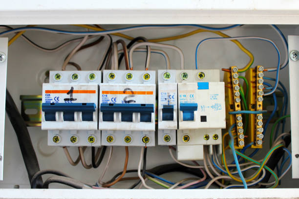 istock electric switchboard with the wires and switches. 682617448