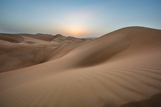 istock sunset over sand dunes of Empty Quarter desert 682618350