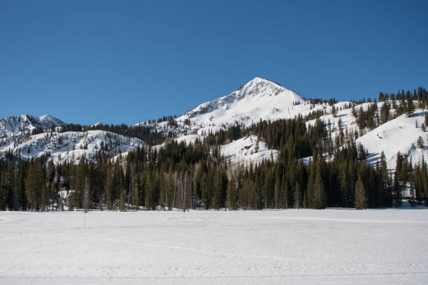 istock Mountain Ridge Above Snow Covered Lake 682628330