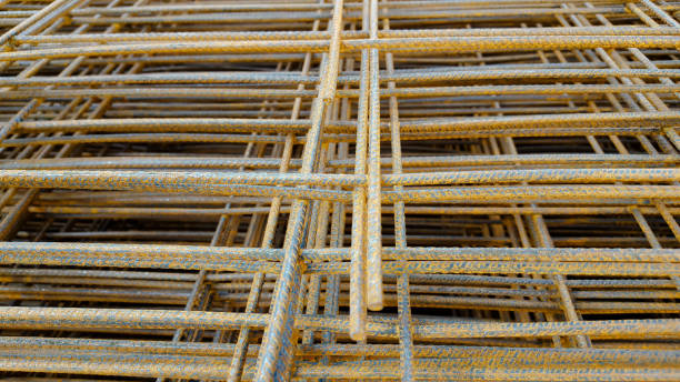 istock reinforcing mesh, steel bars stacked for construction 682631624
