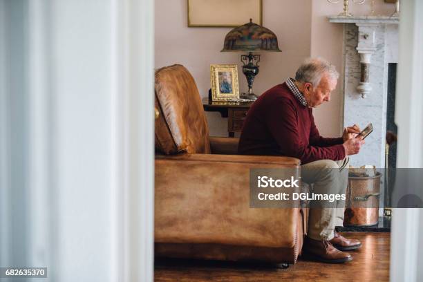 Bringing Back Memories Stock Photo - Download Image Now - Senior Adult, Loneliness, Grief