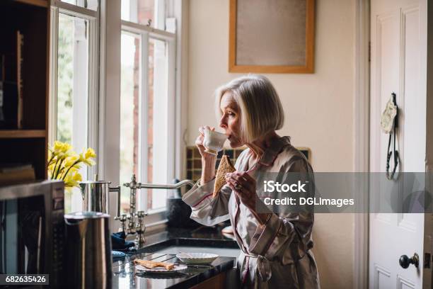 Tea And Toast For Breakfast Stock Photo - Download Image Now - Eating, Bathrobe, Senior Adult