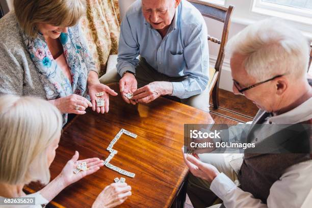 Seniors Playing Dominoes Stock Photo - Download Image Now - Senior Adult, Recreational Pursuit, Nursing Home