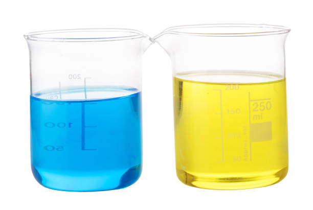 istock yellow and blue chemical liquid in glass 682635932