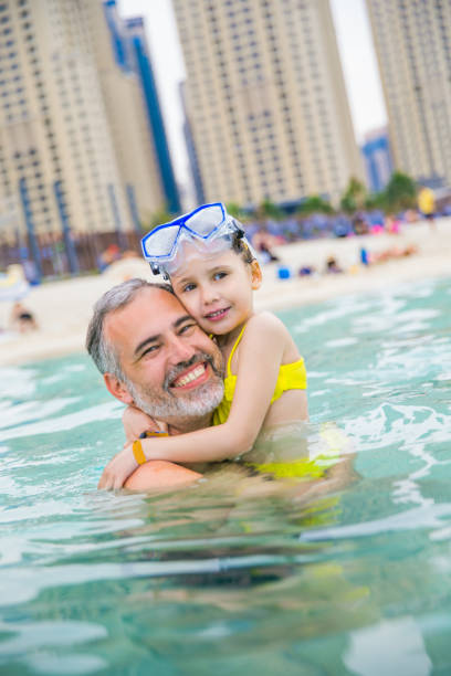 istock Father And Daughter Enjoying At The Dubai Beach 682639254