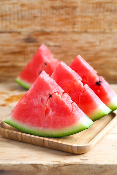 istock Fresh sliced watermelon on wooden background 682639488