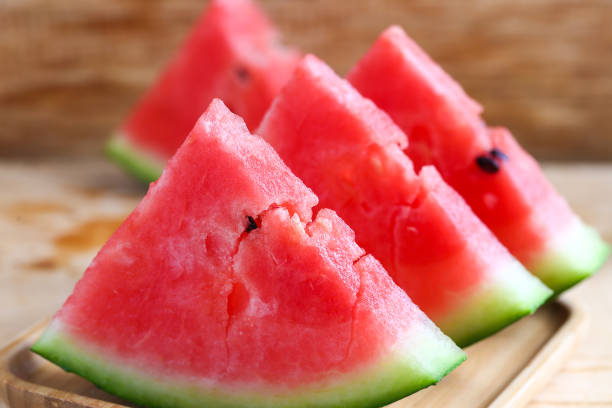 istock Fresh sliced watermelon on wooden background 682639678