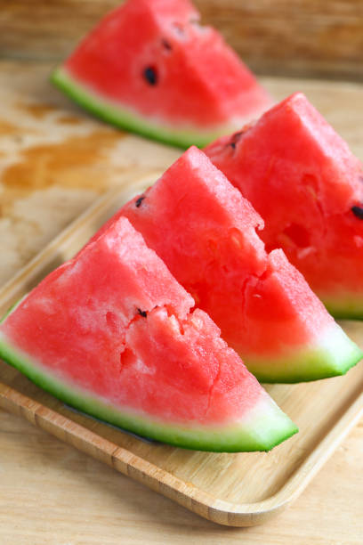 istock Fresh sliced watermelon on wooden background 682639896