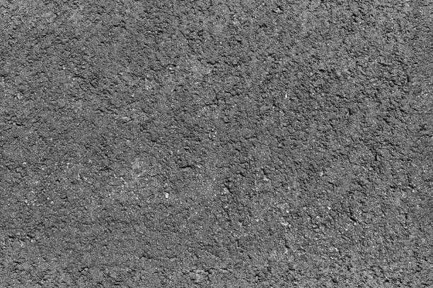 istock Road pavement, rough gray asphalt concrete 682645602