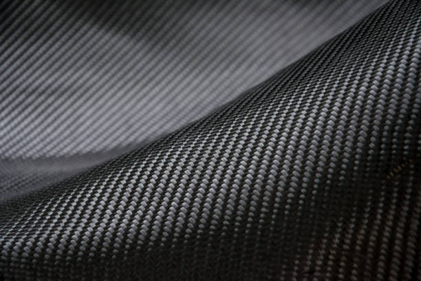 istock Carbon fiber composite raw material background 682654158