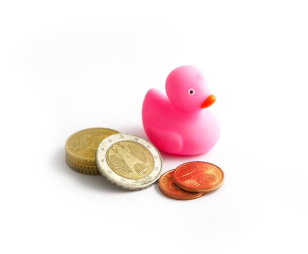 Photo depicting a pink rubber duck, isolated on a white background. Children bath toy rubber ducky. Macro, close up view.