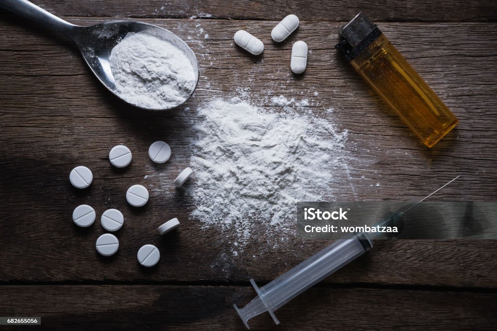 Hard drugs on dark table Medicine Stock Photo