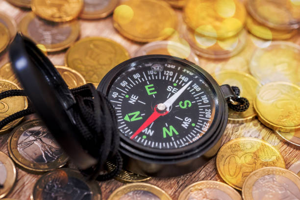 istock Financial concept  - compass with gold coin. close up. 682655206