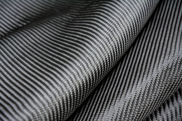 istock Carbon fiber composite raw material background 682658578
