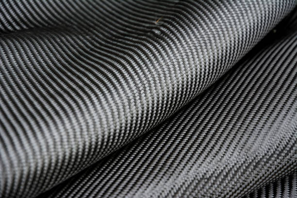istock Carbon fiber composite raw material background 682658786