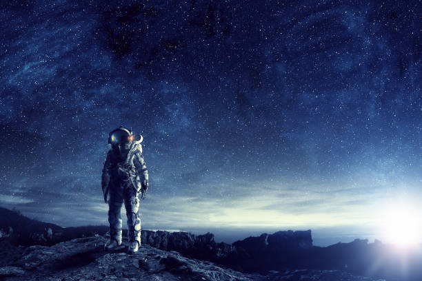 Astronaut in outer space. Mixed media Astronaut in space suit. Elements of this image furnished by NASA cosmonaut stock pictures, royalty-free photos & images