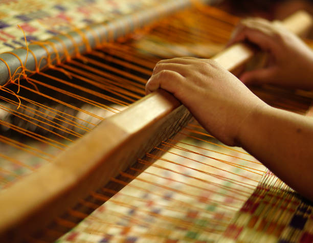 istock Asian women are making textiles for family use. 682665658