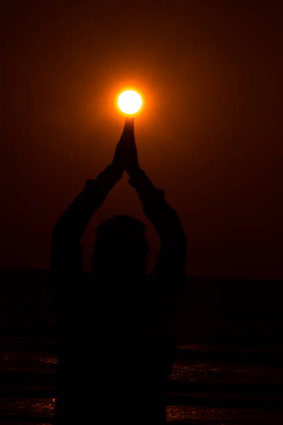 person holding sun